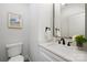 Clean bathroom with white vanity, black fixtures, and a large mirror at 10605 S Hampton Dr, Charlotte, NC 28227