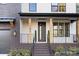 Inviting front entrance with modern door, stone steps, and landscaping at 10605 S Hampton Dr, Charlotte, NC 28227