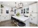 Spacious kitchen with white cabinets, quartz countertops, and a large island with seating at 10605 S Hampton Dr, Charlotte, NC 28227