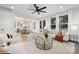 Bright and airy living area with open floor plan, hardwood floors, and a view to the kitchen at 10605 S Hampton Dr, Charlotte, NC 28227