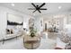 Open and airy living room with hardwood floors and views into the kitchen and dining areas at 10605 S Hampton Dr, Charlotte, NC 28227
