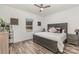 Cozy bedroom featuring a comfortable bed, wooden furnishings, and natural light from the window at 1076 Furnace Rd, Iron Station, NC 28080