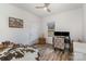 Bright bedroom with wood-look floors, desk area, and large window for natural light at 1076 Furnace Rd, Iron Station, NC 28080