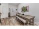 Dining area featuring a wooden table and bench seating at 1076 Furnace Rd, Iron Station, NC 28080