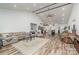 Open concept living room features hardwood floors and a view of the kitchen at 1076 Furnace Rd, Iron Station, NC 28080