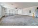 A spacious two car garage with a concrete floor and plenty of storage at 1112 Wiscassett St, Albemarle, NC 28001