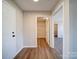Hallway with access to bedrooms and closets featuring hardwood floors at 1112 Wiscassett St, Albemarle, NC 28001