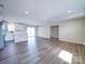 The airy living room features new floors, plenty of natural light, and an open design at 1112 Wiscassett St, Albemarle, NC 28001