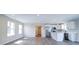 Spacious living room with an open layout to the kitchen, stainless steel appliances, and ample lighting at 1112 Wiscassett St, Albemarle, NC 28001