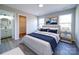 Bedroom with ensuite bathroom and walk-in closet, featuring neutral walls and multiple windows at 1112 Wiscassett St, Albemarle, NC 28001