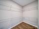 This walk-in closet features vinyl flooring and wire shelving at 1112 Wiscassett St, Albemarle, NC 28001