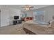 Bedroom with a queen-size bed and sitting area at 11906 Bending Branch Rd, Charlotte, NC 28227