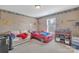 bedroom with a sofa, bed, and shelving at 11906 Bending Branch Rd, Charlotte, NC 28227