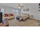 Bedroom with a queen-size bed and sitting area at 11906 Bending Branch Rd, Charlotte, NC 28227