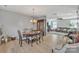 Open concept dining room with a round wood table and access to the living room at 11906 Bending Branch Rd, Charlotte, NC 28227