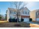 Two-story house with brick and siding, attached garage, and landscaping at 11906 Bending Branch Rd, Charlotte, NC 28227