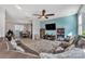 Spacious living room with sectional sofa, and adjacent dining area at 11906 Bending Branch Rd, Charlotte, NC 28227
