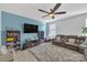 Living room with sectional sofa, TV, and built-in shelving at 11906 Bending Branch Rd, Charlotte, NC 28227
