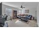 Spacious living room with L-shaped sofa, and ample natural light at 11906 Bending Branch Rd, Charlotte, NC 28227