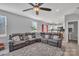 Open living room with sectional sofa, view of kitchen and bathroom at 11906 Bending Branch Rd, Charlotte, NC 28227