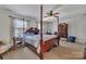 Main bedroom with a large bed and dresser at 11906 Bending Branch Rd, Charlotte, NC 28227