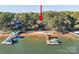 Lakefront property with private beach, dock, and wooded surroundings at 121 Stormy Pointe Ln, Mooresville, NC 28117