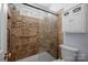 Bathroom with shower/tub combo and updated tile-work at 121 Stormy Pointe Ln, Mooresville, NC 28117