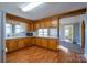 View of kitchen with wood cabinets and appliances at 170 Friendship Ln, Kannapolis, NC 28081