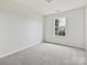 Small bedroom with window and neutral wall color at 173 Brookshire Dr, Fort Mill, SC 29715