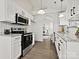 Modern kitchen with white cabinets, granite countertops, and stainless steel appliances at 173 Brookshire Dr, Fort Mill, SC 29715