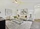 Spacious living room with hardwood floors, neutral decor, and a cozy seating area at 173 Brookshire Dr, Fort Mill, SC 29715