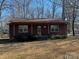 Ranch style home with covered porch and mature trees at 1993 Powell Ave, Lancaster, SC 29720