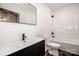 Clean bathroom with a bathtub and dark vanity at 219 Mock Mill Rd, Statesville, NC 28677