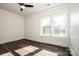 Bright bedroom with dark wood flooring and two windows at 219 Mock Mill Rd, Statesville, NC 28677