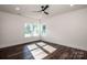 Bright bedroom with hardwood floors and large windows at 219 Mock Mill Rd, Statesville, NC 28677