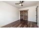 Bedroom with double doors and ceiling fan at 219 Mock Mill Rd, Statesville, NC 28677