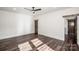 Spacious bedroom with dark hardwood floors and ceiling fan at 219 Mock Mill Rd, Statesville, NC 28677