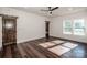 Bright bedroom with hardwood floors and rustic doors at 219 Mock Mill Rd, Statesville, NC 28677