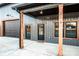 Gray metal siding, covered porch, and black garage door at 219 Mock Mill Rd, Statesville, NC 28677