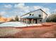 Gray metal barn-style home with covered porch at 219 Mock Mill Rd, Statesville, NC 28677