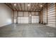 Spacious garage with two large doors and high ceilings at 219 Mock Mill Rd, Statesville, NC 28677