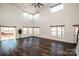 Spacious living room with large windows and hardwood floors at 219 Mock Mill Rd, Statesville, NC 28677