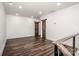 Open loft area with dark wood flooring and two doors at 219 Mock Mill Rd, Statesville, NC 28677