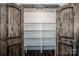 Walk-in pantry with ample shelving and rustic doors at 219 Mock Mill Rd, Statesville, NC 28677
