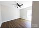 Large bedroom with wood floors, a window, and neutral wall color at 2220 Badin Rd, Albemarle, NC 28001