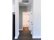 Hallway with access to the bathroom and white trim at 2220 Badin Rd, Albemarle, NC 28001