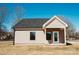 Rear exterior elevation showing covered rear porch and siding details at 2220 Badin Rd, Albemarle, NC 28001