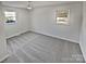 Well-lit bedroom with carpet flooring and two windows at 2804 Lyndell Way, Lancaster, SC 29720