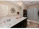 Bathroom featuring double sinks, and a blue-patterned shower curtain at 3020 Graceland Cir # 11D, Pineville, NC 28134