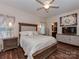 Serene bedroom featuring a comfortable bed, hardwood floors, a ceiling fan, and ample natural light at 3020 Graceland Cir # 11D, Pineville, NC 28134